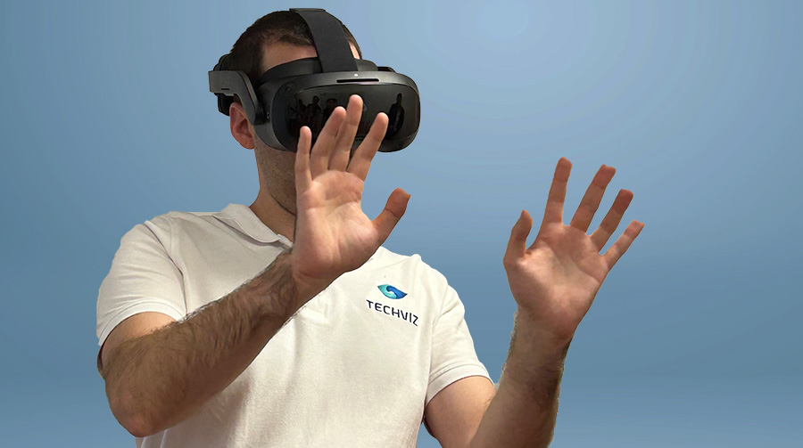 techviz-engineer-wearing-a-htc-vive-focus-3-and-using-native-fingertracking